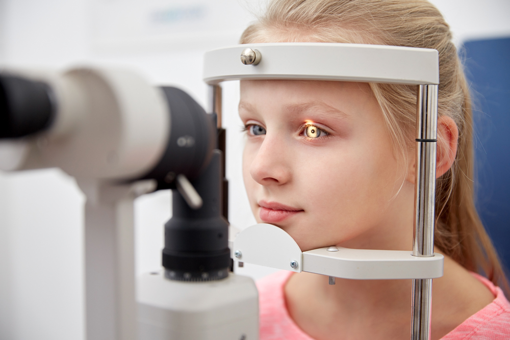 Little girl getting an eye exam.