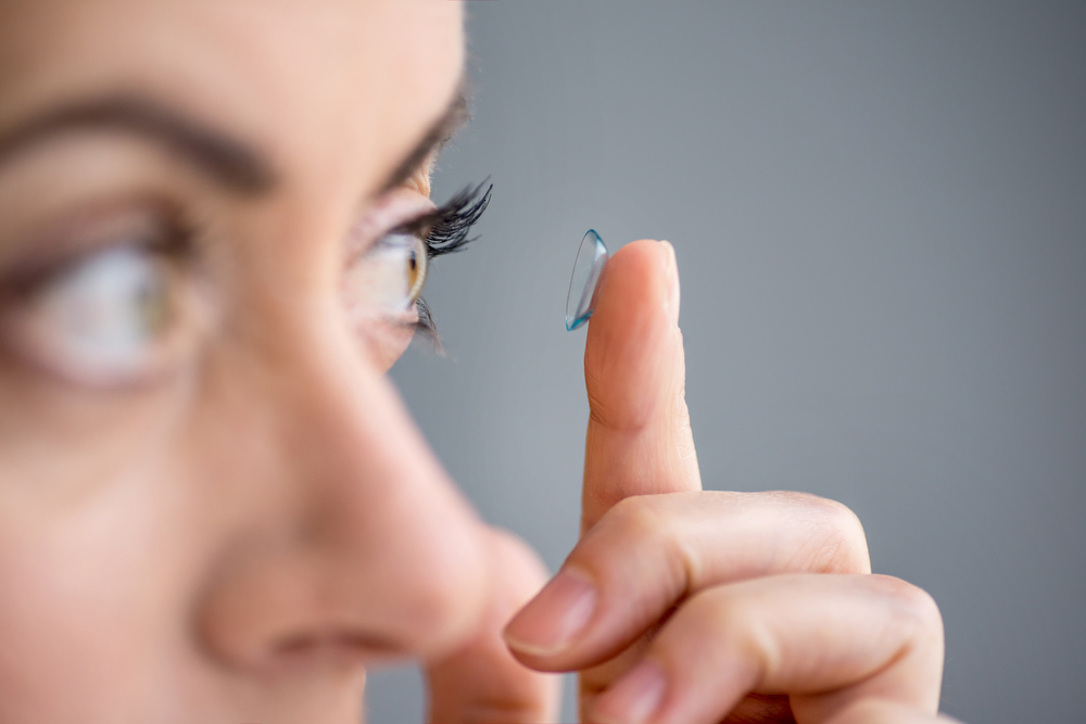 woman with astigmatism using contact lenses
