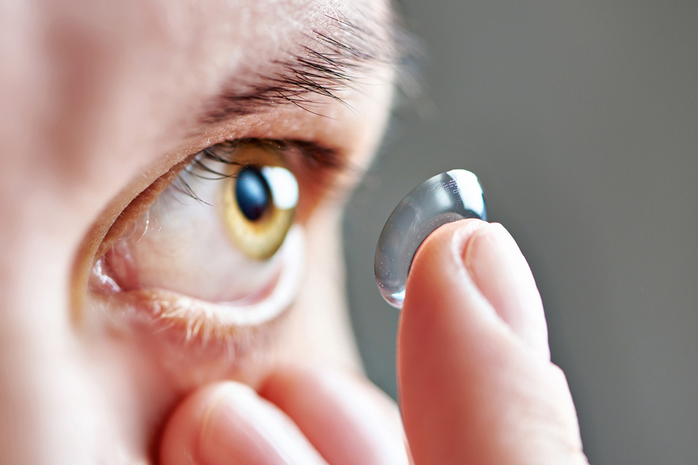 Man applying Scleral Lenses for the first time.