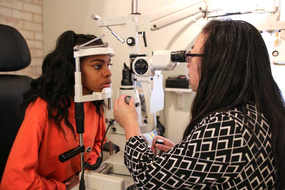 Woman getting an eye exam.