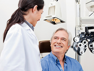 female eye doctor examining patient