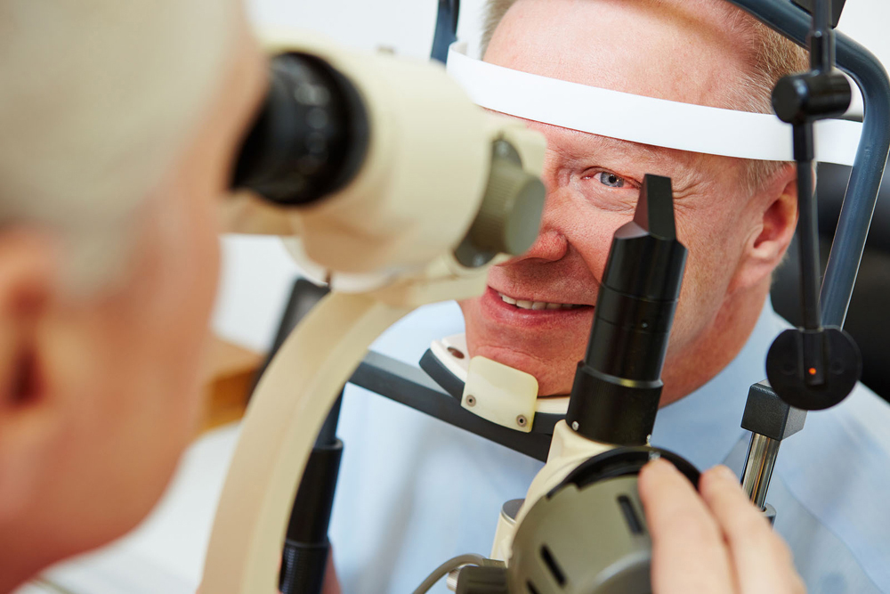 Man getting checked for macular degeneration.