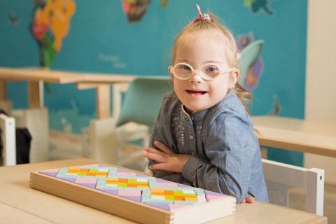Young special needs girl using vision tools