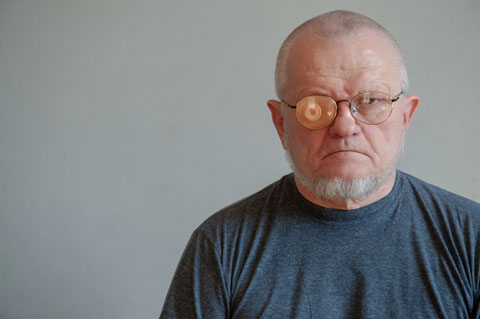 Older man with patch on glasses